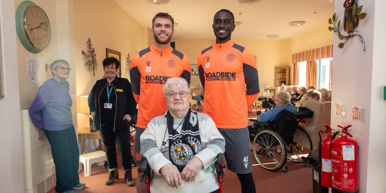 Marcus Fraser and Elvis Bwomono chat with Ralston Day Centre Service Users