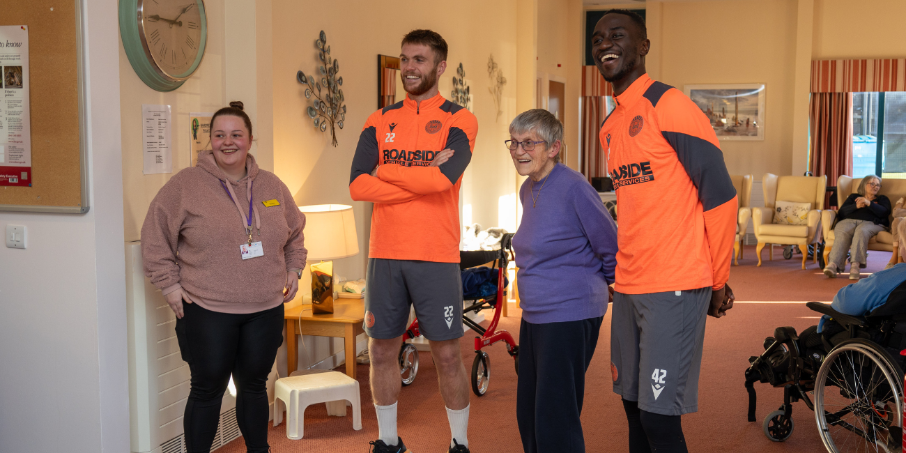 Marcus Fraser and Elvis Bwomono chat with Ralston Day Centre Service Users