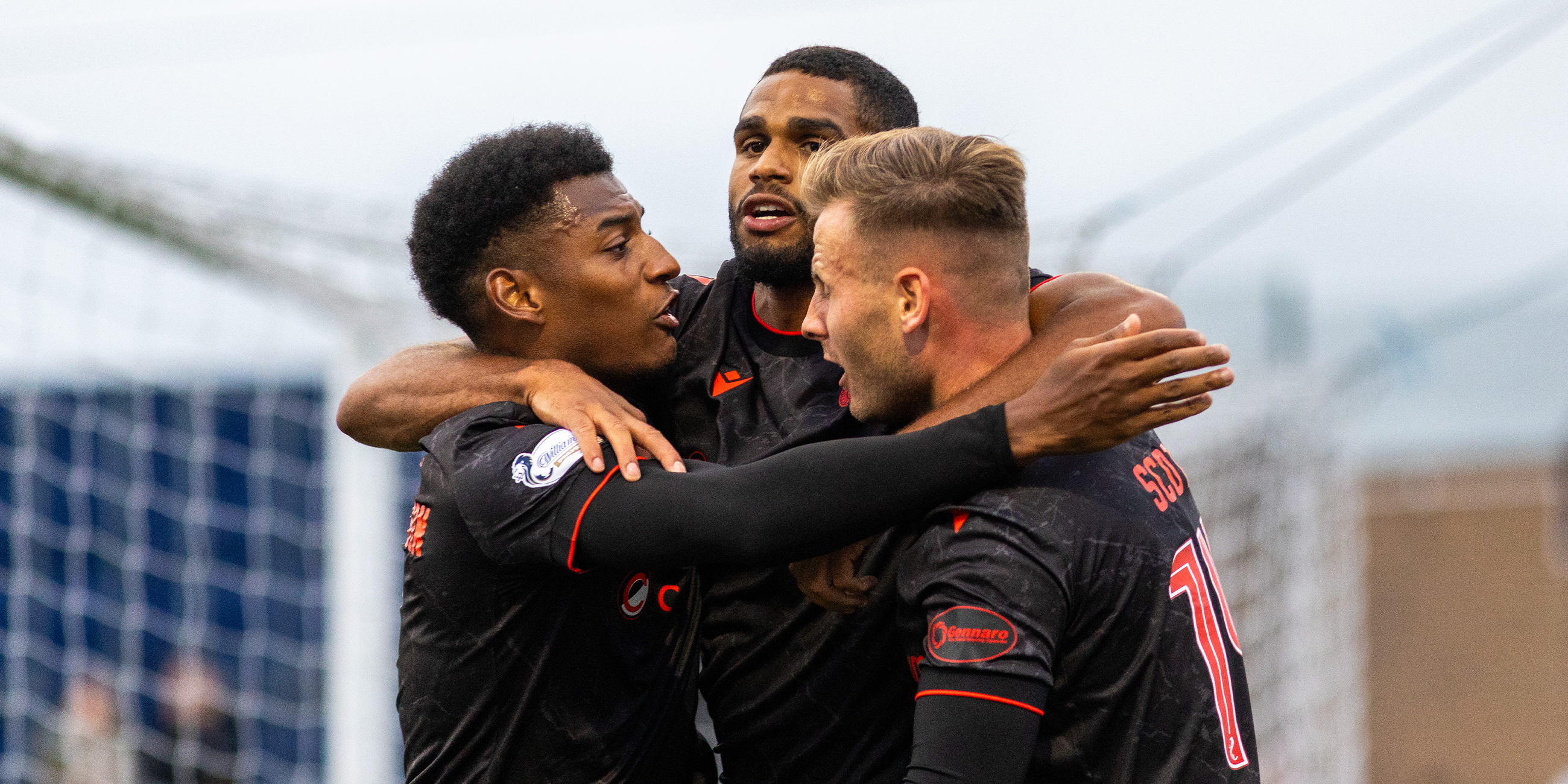 Mikael Mandron celebrates with Jayden Richardson and James Scott
