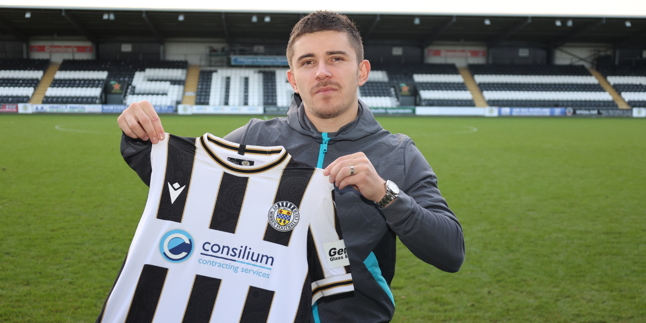 Declan John poses with a St Mirren shirt after agreeing short-term move