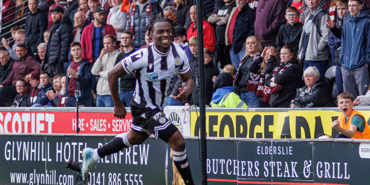 Toyosi Olusanya celebrates after scoring winner against Hearts