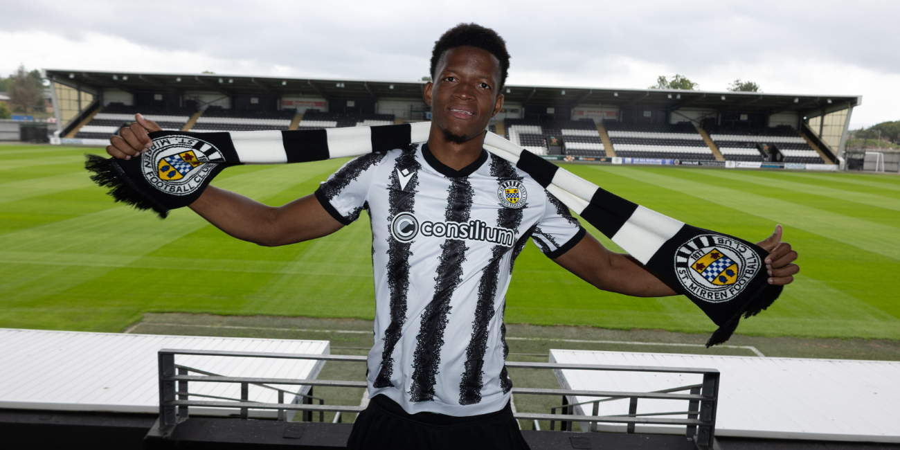 Richard King poses with a St Mirren scarf