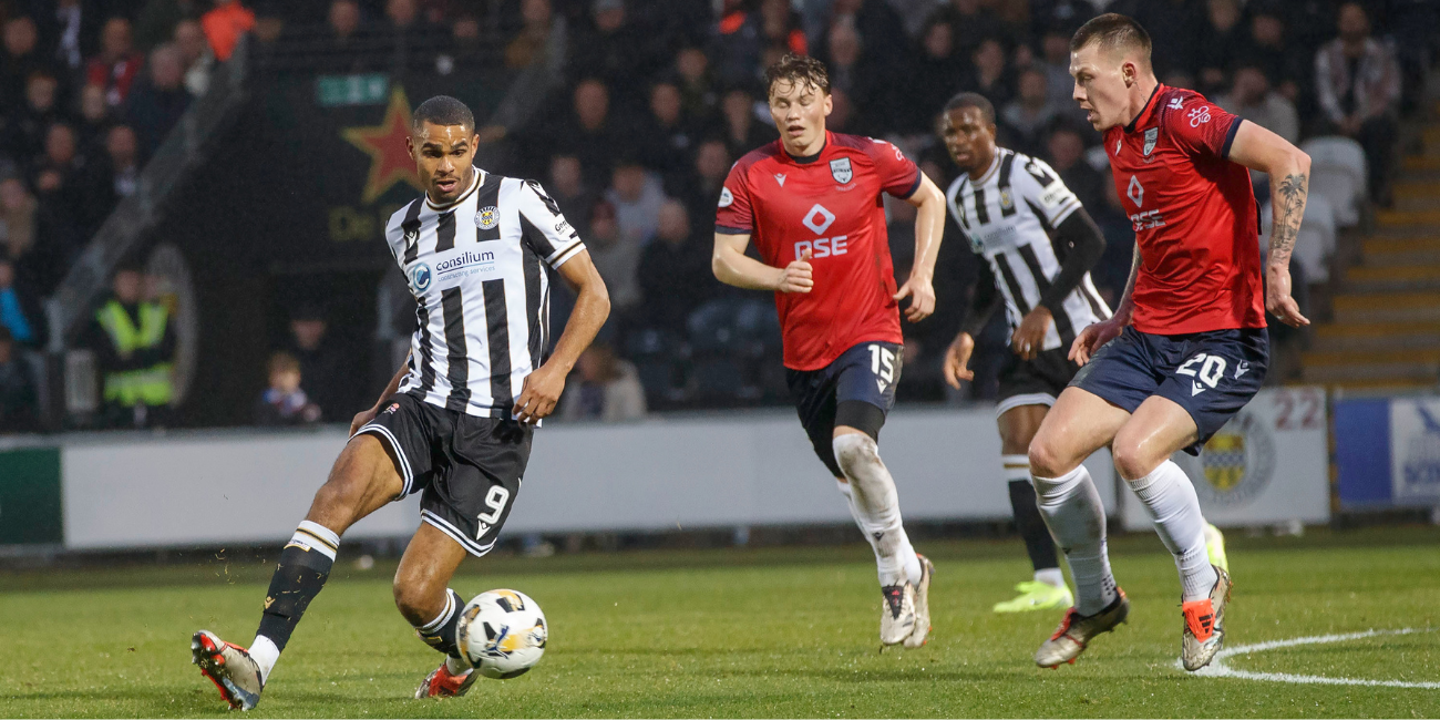 Mikael Mandron passes the ball in action against Ross County